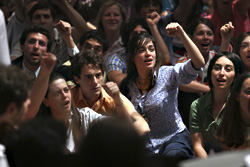 Brother Germano (in orange shirt at center) doesn't share the radicalism of Fleri (in blue at right)