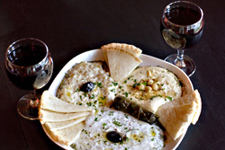 Turkuaz plate (babaghanuj, humus, cacik, and dolmas).