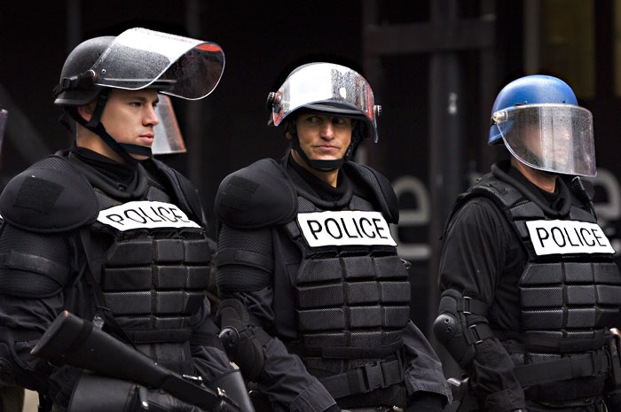 Harrelson (center) shows the good beneath the badge.