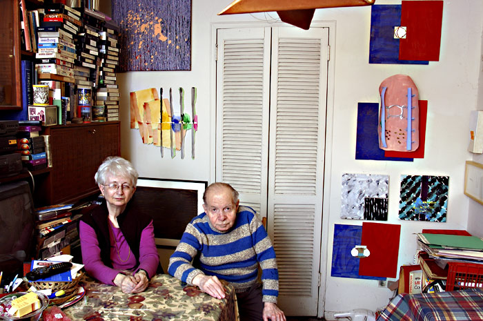 The collectors amid their collection.