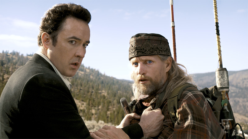 It’s the end of the world, and you just knew Woody Harrelson (right) would be there with Cusack.