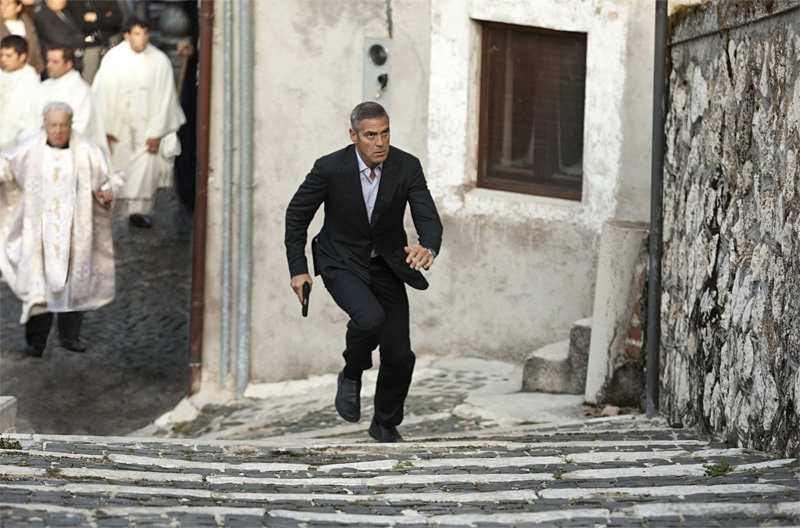 Clooney takes a businesslike tour of Europe.