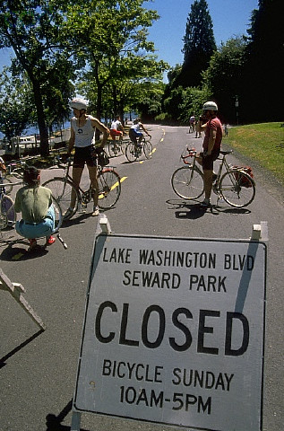 ca. 1970s-1990s, Mount Baker Beach, Seattle, Washington, USA --- Bicyclists prepare to ride along the shores of Lake Washington from Mount Baker Beach to Seward Park.  The boulevard is closed for "Bicycle Sunday" several times a summer.  Seattle, Washington, USA. --- Image by © Joel W. Rogers/CORBIS