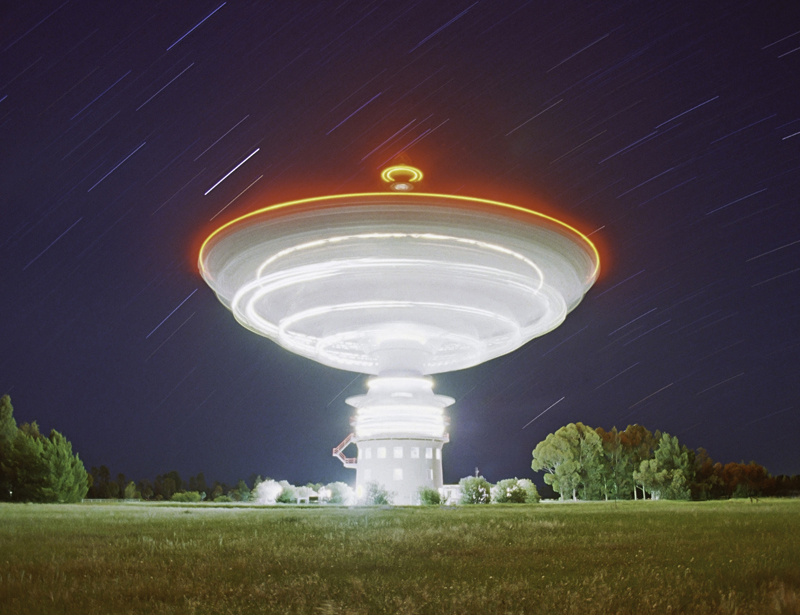 A glance at our insignificance: a rotating radio telescope, as caught by Ressmeyer.