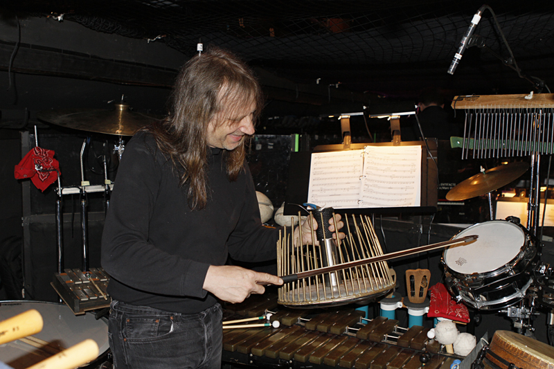 Hansen among his arsenal of percussion instruments.