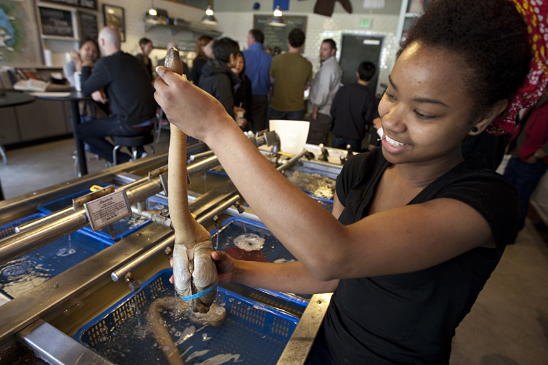 Taylor Shellfish's Nyaria Lee shows off a geoduck "in its full phallic glory."