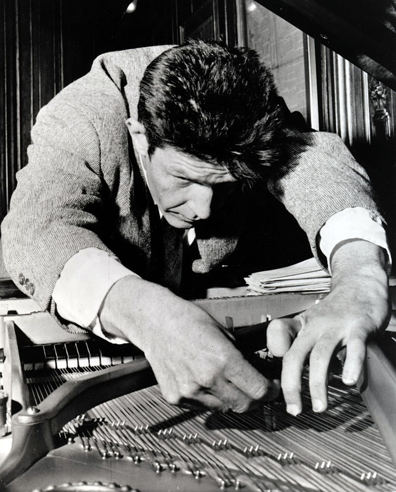 Cage prepares a piano.