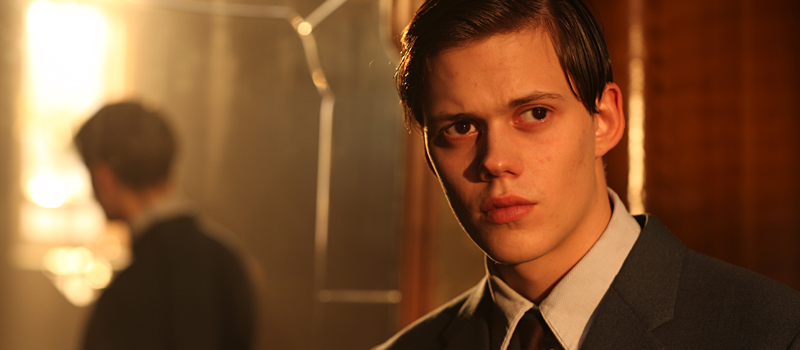 Bill Skarsgård as the grown Simon, a Jew sheltered during the war.