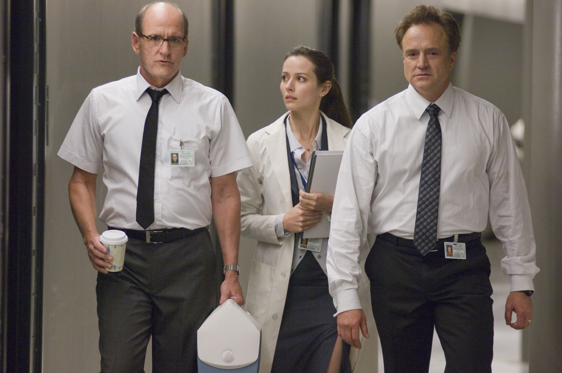 Sitterson (Richard Jenkins, left), Lin (Amy Acker, center) and Hadley (Bradley Whitford, right) in THE CABIN IN THE WOODS.