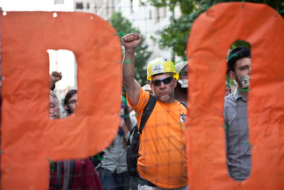 Supporters of the Occupy Wall Street movement marked its first anniversary with a flash rally.