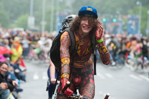 One part critical mass and one part nudist expression, the World Naked