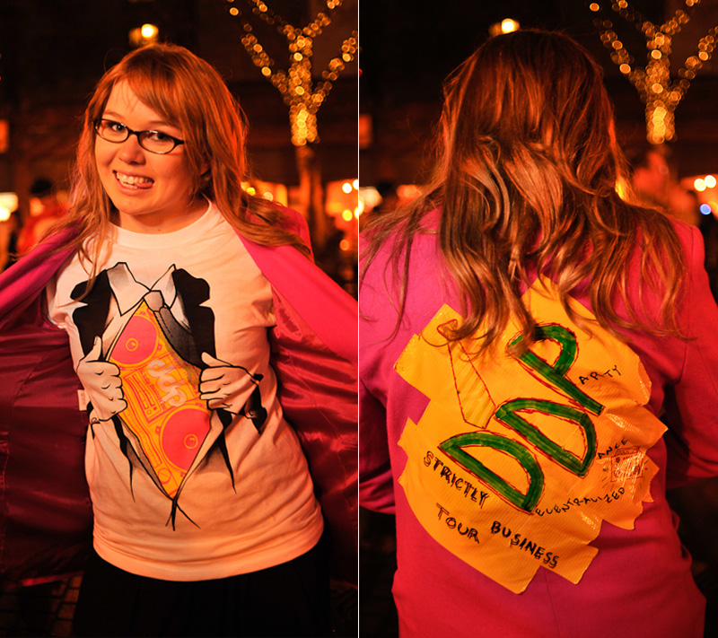 Clad in business attire and wielding boomboxes, hundreds of revelers romped around