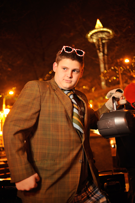 Clad in business attire and wielding boomboxes, hundreds of revelers romped around