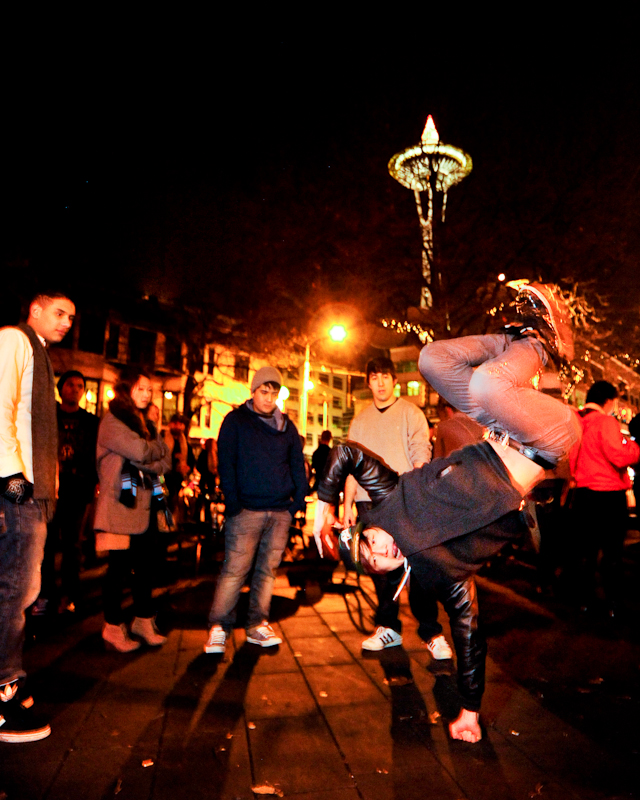 Clad in business attire and wielding boomboxes, hundreds of revelers romped around