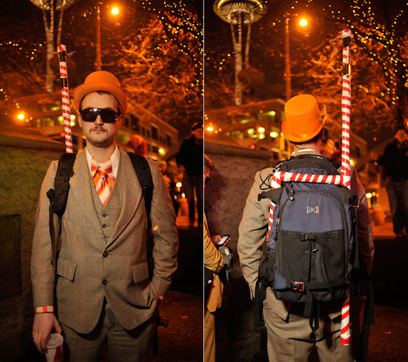 Clad in business attire and wielding boomboxes, hundreds of revelers romped around