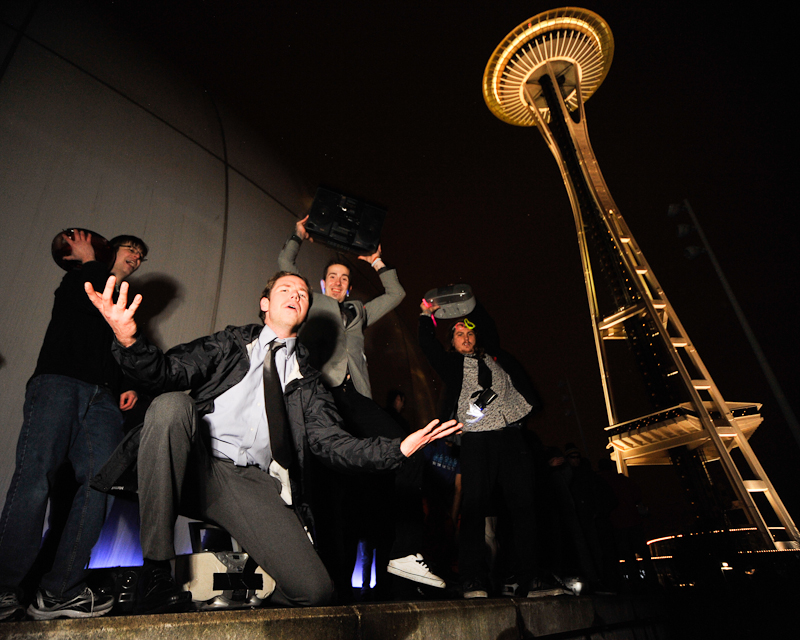 Clad in business attire and wielding boomboxes, hundreds of revelers romped around