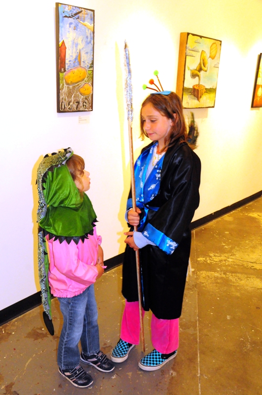 Aeriel and Berit dressed up as a peacock warrior and komodo dragon for the evening.