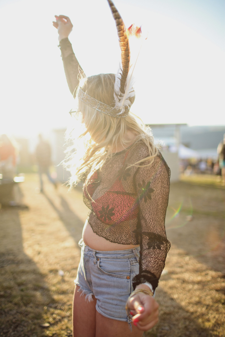 Feathers are great dancing accessories - as are high-waisted cut-off Levi's.