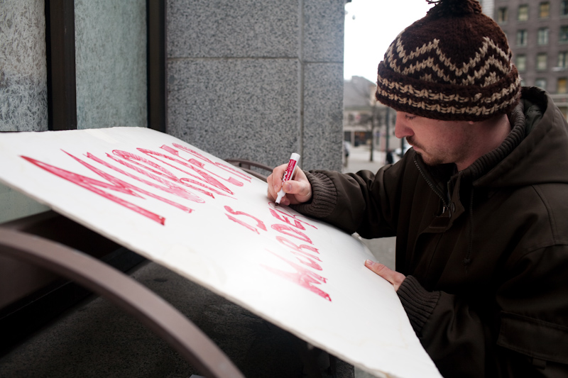 About a dozen protesters gathered today at the King County Courthouse in