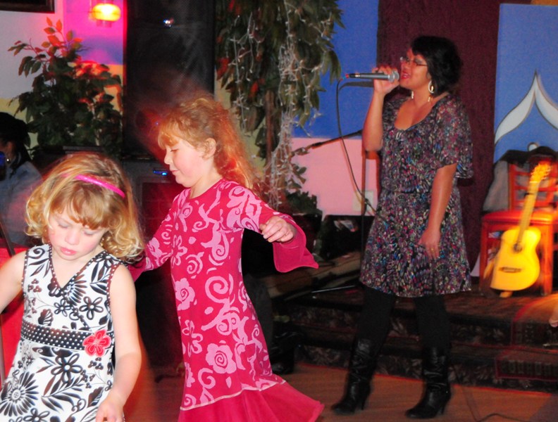 Children dance to Rogue Pinay's music.
