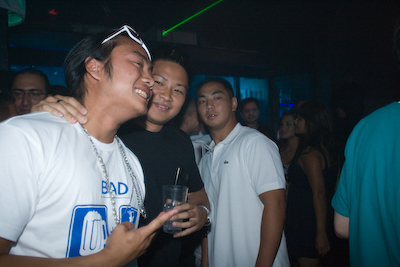 Sahn Junior Pham, center, at Venom, boasts I've converted everyone to the Goose. His living room is home to about 100 empty bottles of the premium vodka.