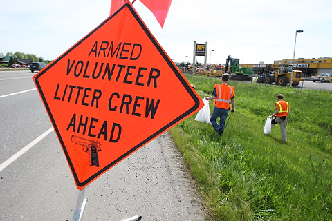 A group from OpenCarry.org pick up trash along their area along Interstate 5 Freeway near Fife as part of the Adopt-A-Highway program on Sunday, May 17, 2009. The group supports the right to carry a firearm . (Kevin P. Casey/Seattle Weekly)