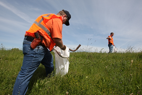 A group from OpenCarry.org pick up trash along their area along Interstate 5 Freeway near Fife as part of the Adopt-A-Highway program on Sunday, May 17, 2009. The group supports the right to carry a firearm . (Kevin P. Casey/Seattle Weekly)