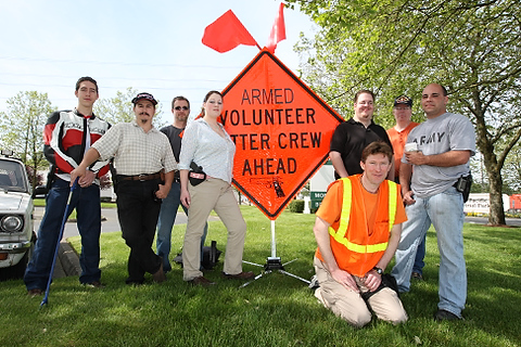 A group from OpenCarry.org pick up trash along their area along Interstate 5 Freeway near Fife as part of the Adopt-A-Highway program on Sunday, May 17, 2009. The group supports the right to carry a firearm . (Kevin P. Casey/Seattle Weekly)