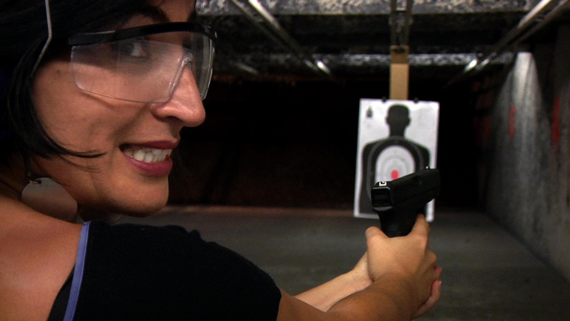 Farsad tries her hand at the gun range.