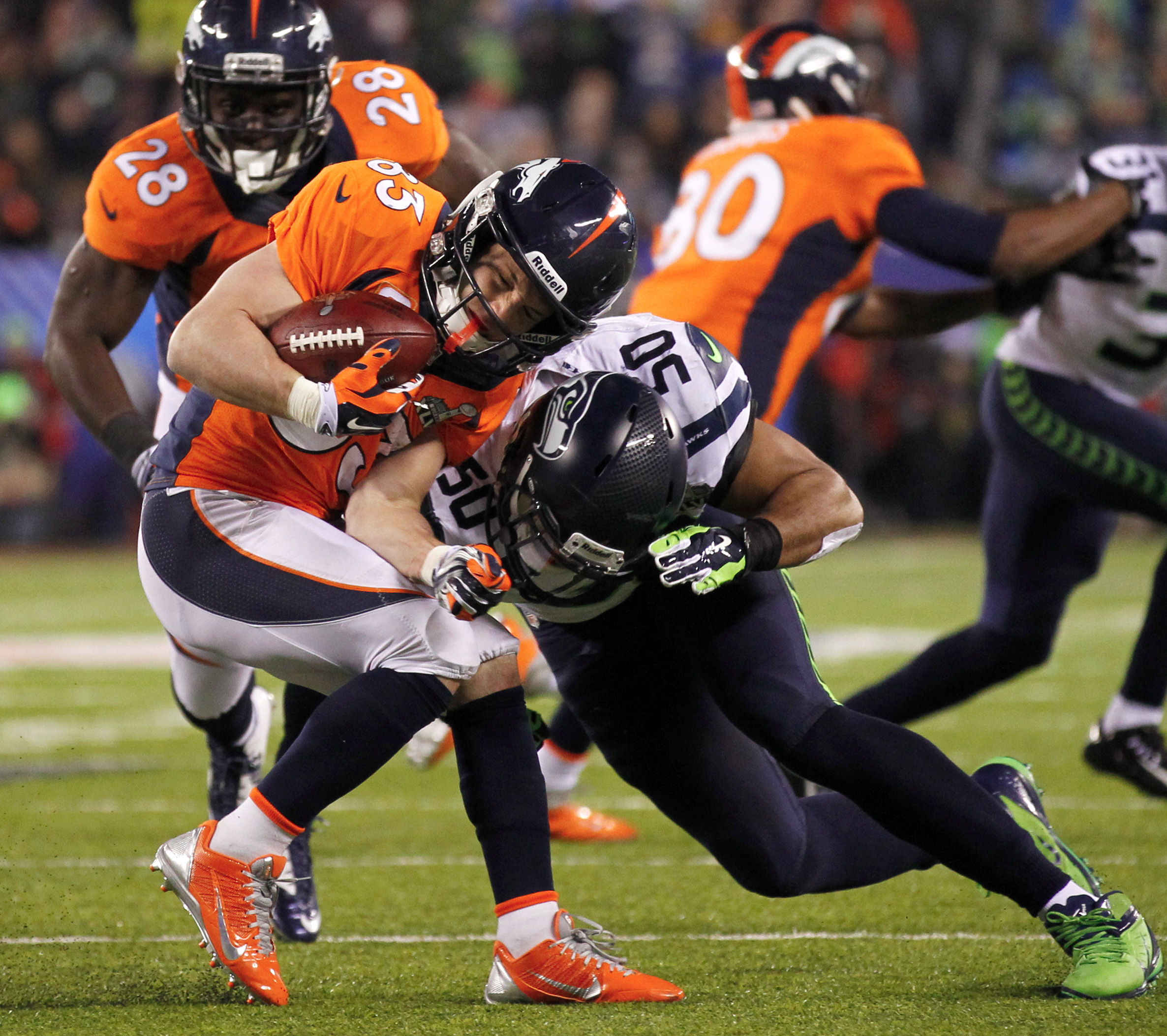 Seattle’s Super Bowl shellacking of the Denver Broncos portended future greatness for the very young team. University of Washington alumnus Jermaine Kearse, left, bounced off Denver’s defense with the youthful aplomb afforded 23-year-olds. K.J. Wright, above left, crushed the comparatively elderly Wes Welker. Zach Miller attempted to forge a connection with Kearse and Derrick Coleman, above right, despite the fact that, unlike his younger teammates, the 28-year-old tight end was alive during the Reagan administration. And 25-year-old Russell Wilson, top, hoisted his first Lombardi Trophy.