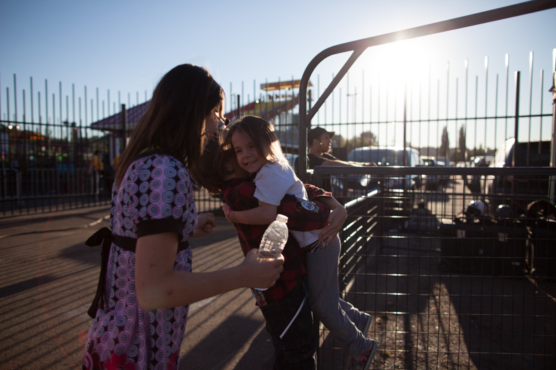 After a successful run, a pint-sized competitor receives a hug from her older sibling.
