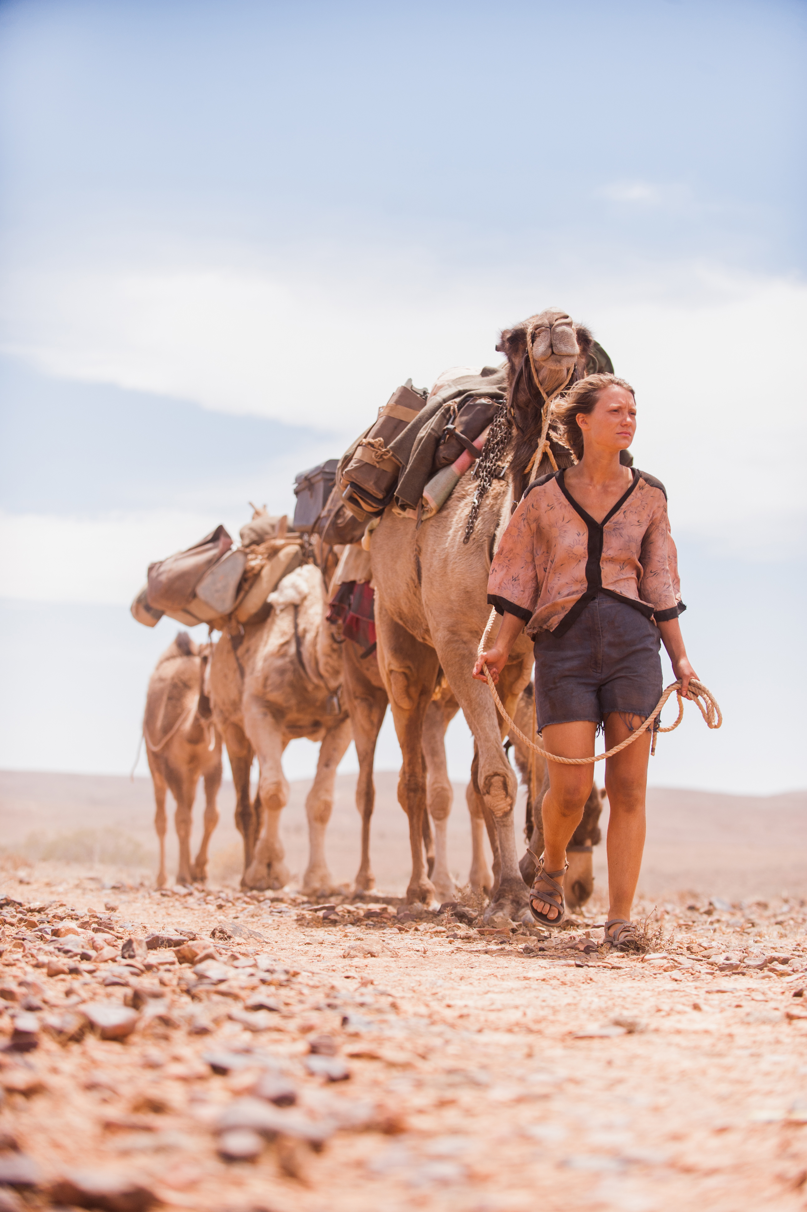 Robyn (Wasikowska) and her camel train.