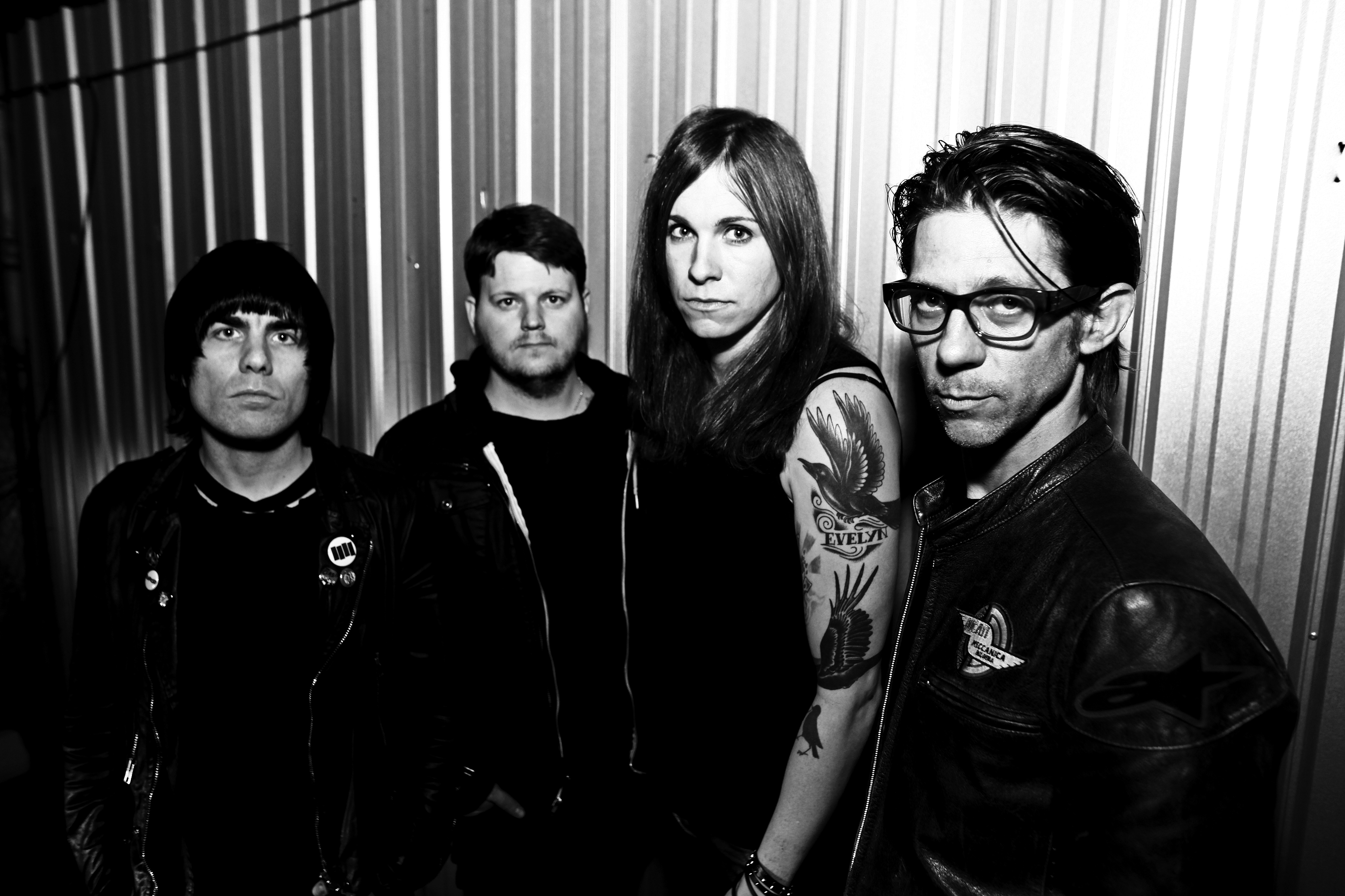 Against Me!'s Laura Jane Grace, third in from left.