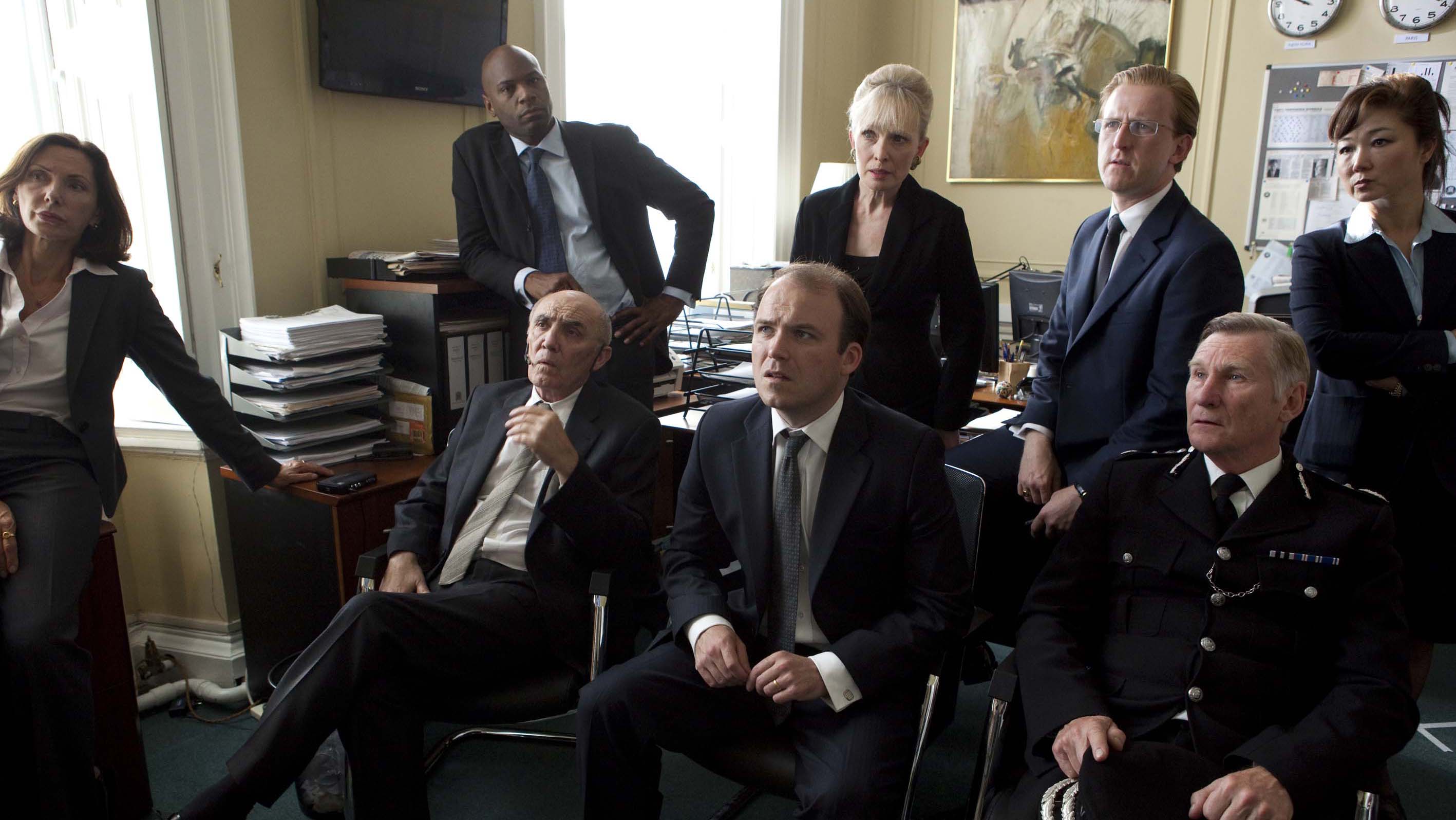 Rory Kinnear (center) as the aghast PM receiving his ransom demand in “The National Anthem.”