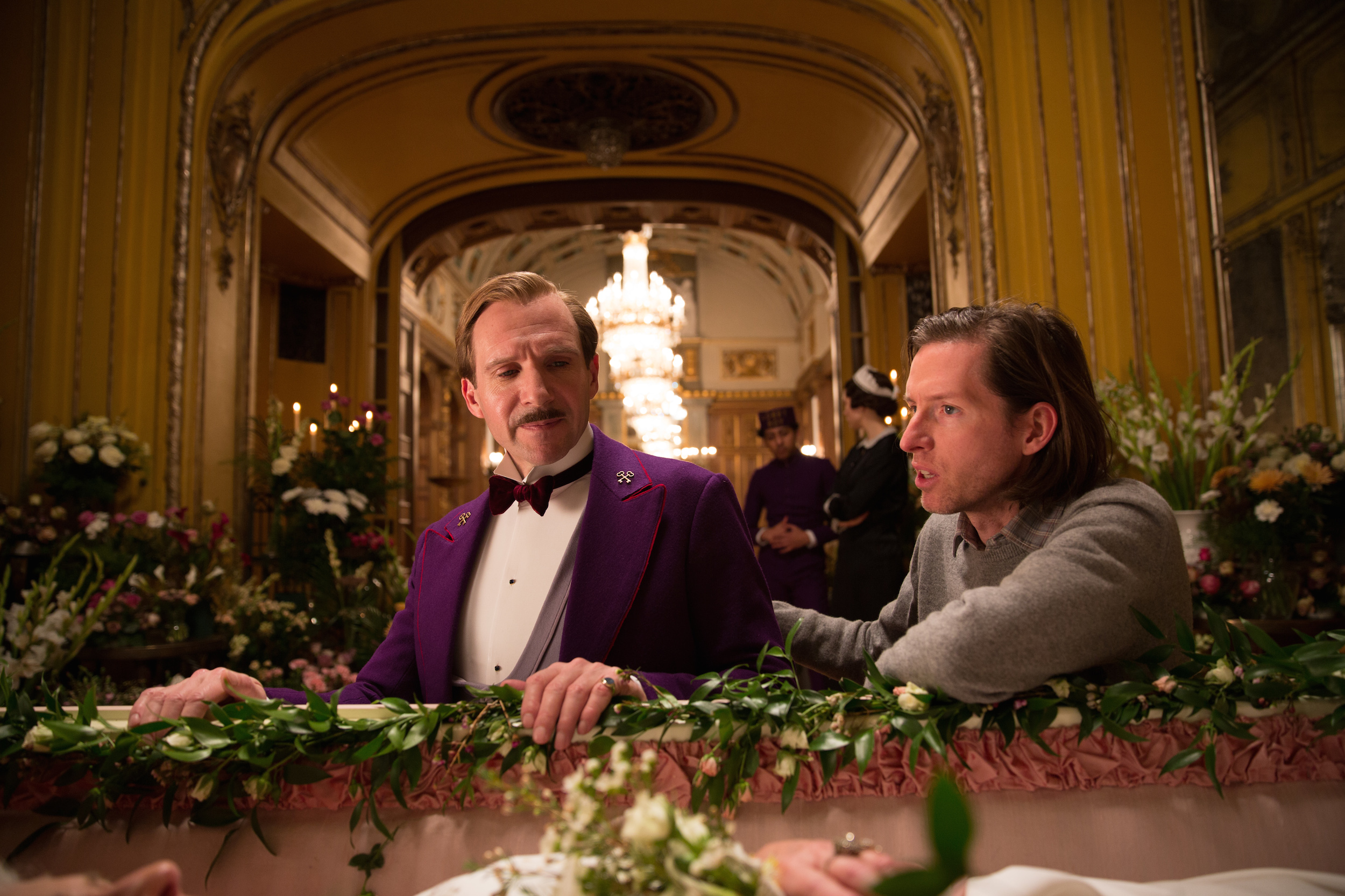 Anderson (right) directs Fiennes in The Grand Budapest Hotel.