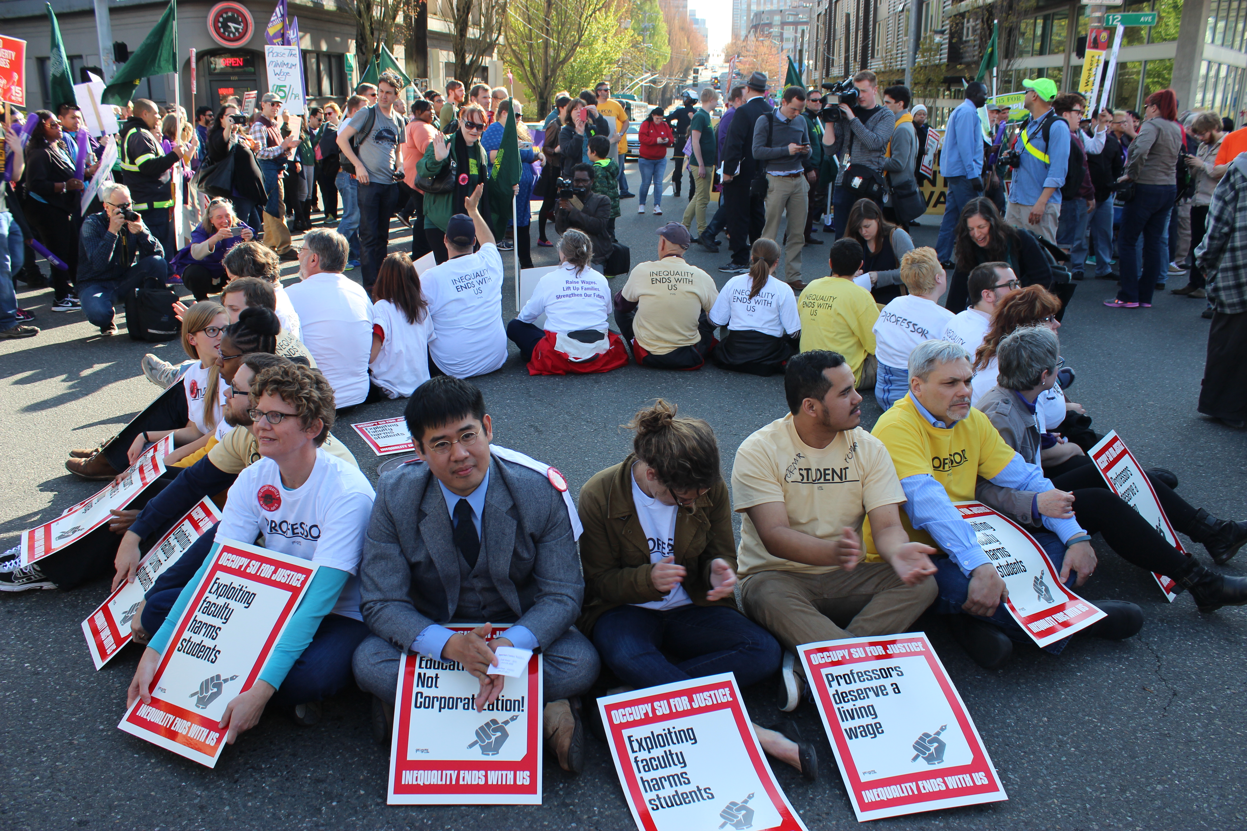 Protesters form a circle at the intersection of 12th and Madison. Photo by Casey Jaywork