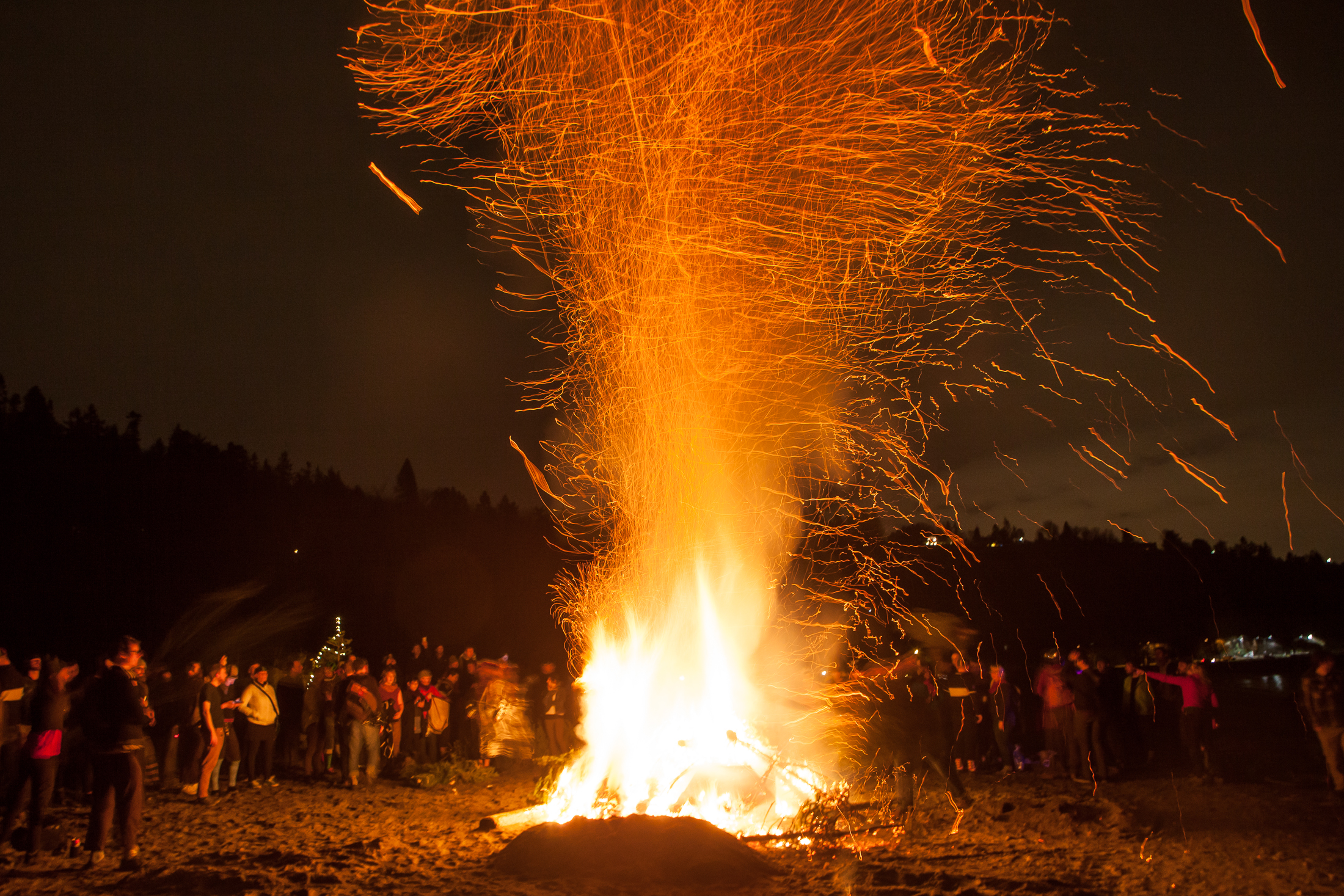 Participants take part in a giant New Year's Christmas Tree bonfire at Golden Gardens Park in early January.
