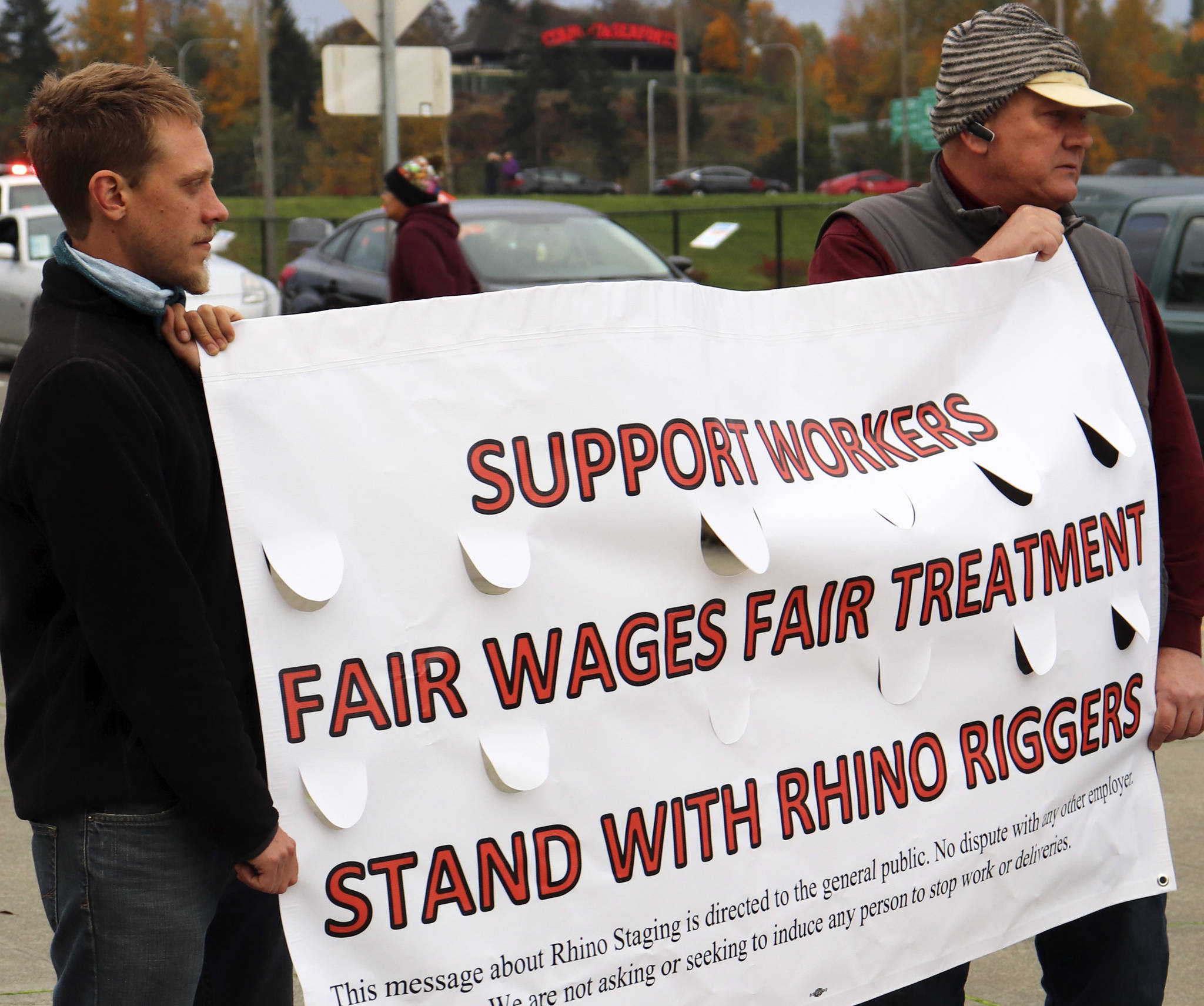 Photo courtesy of IATSE                                Rhino riggers hold an International Alliance of Theatrical Stage Employees banner outside of the Drake concert at the Tacoma Dome on Nov. 1, 2018.