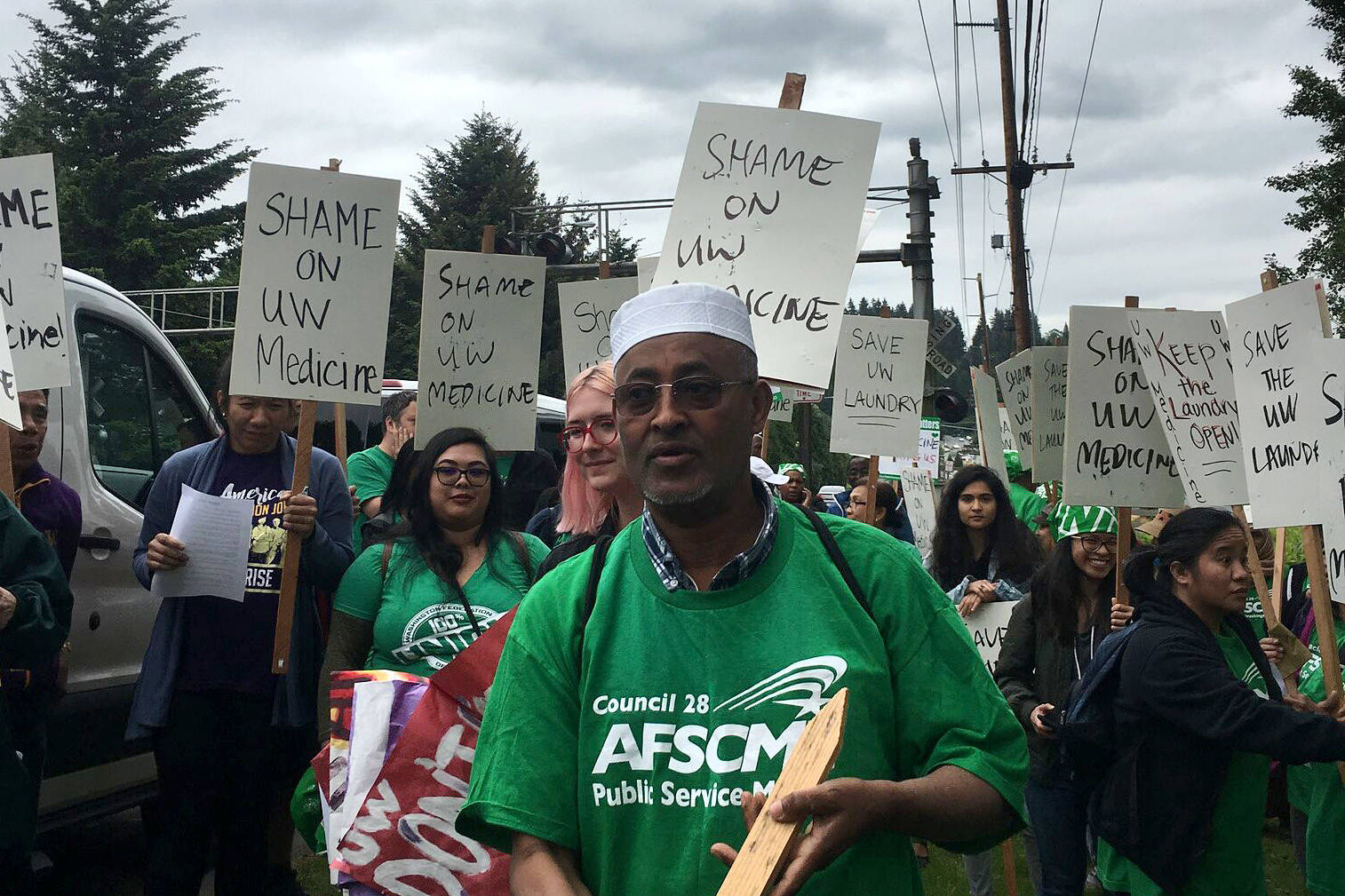 Mustafa Getahun and other Washington Federation of State Employees laundry workers picket University of Washington Medicine at Chateau Ste. Michelle Winery on May 17, 2018. Photo courtesy of the Washington Federation of State Employees