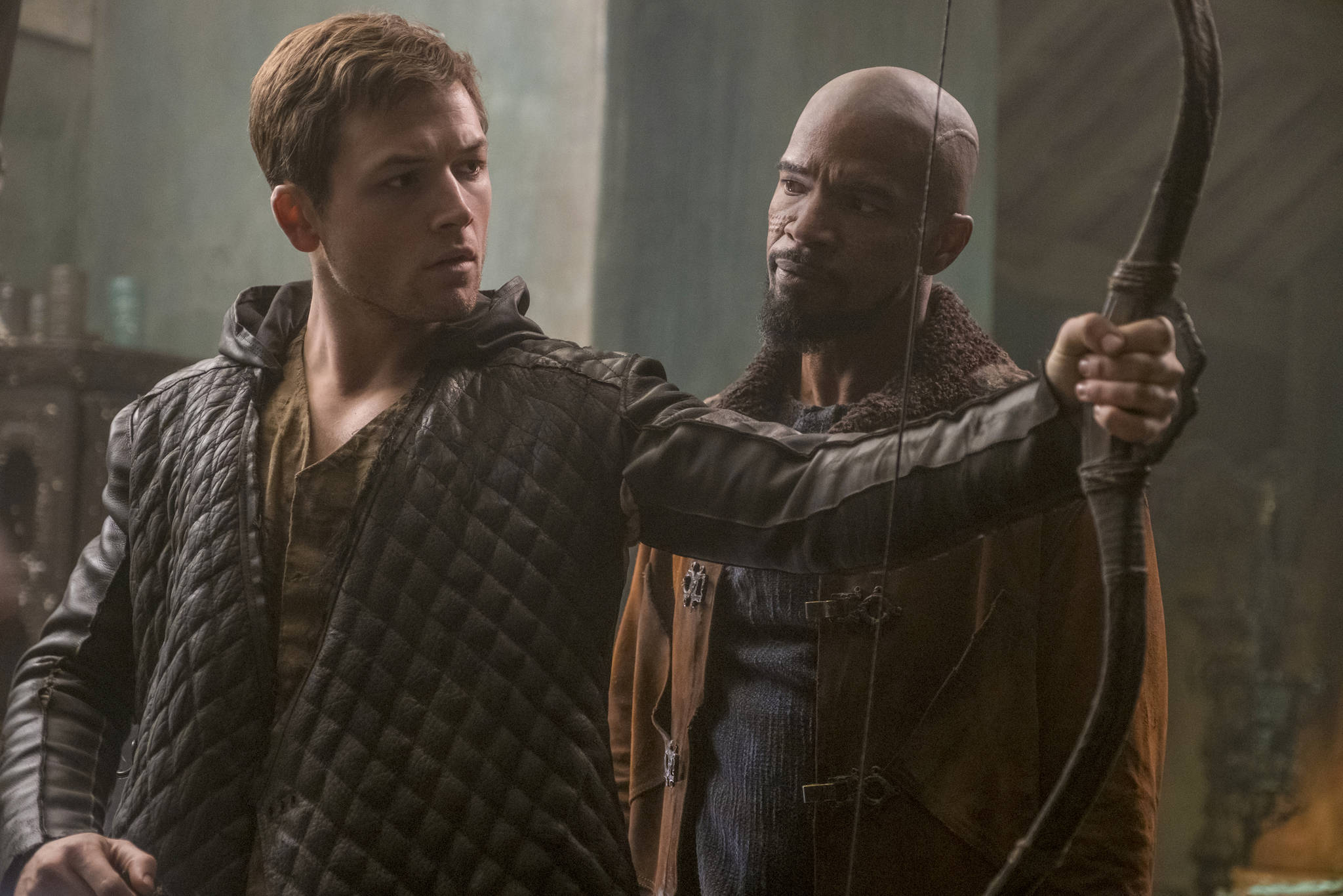Taron Egerton (Robin) and Jamie Foxx (John) take another crack at the classic in Robin Hood. Photo by Larry Horricks