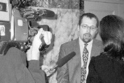 Miller confronts the cameras again at a recent hearing.