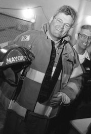 Mayor Greg Nickels has generated enough political heat to require a fire helmet.