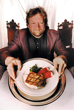 Tom Douglas, the creator of Teatro ZinZanni's menu, shows off his grilled albacore main dish.