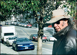 An apple falling close to the tree, about to roll far away.