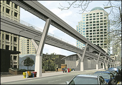 An artist's photo-illustration of the monorail on Second Avenue at Madison Street.