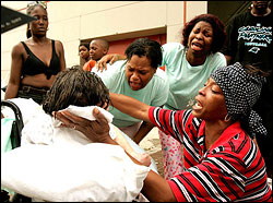 Thursday, Sept. 1: Relatives anguish over an 89-year-old woman who is near death at the Ernest M. Morial Convention Center in New Orleans.