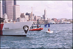 Aug. 5, 2004: The flag-bearing protest inflatable crewed by Glen Milner and Mike McCormick tries to leave Elliott Bay, but the Coast Guard intervenes.