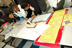 Preparing save-our-school signs and petitions at Thurgood Marshall Elementary.
