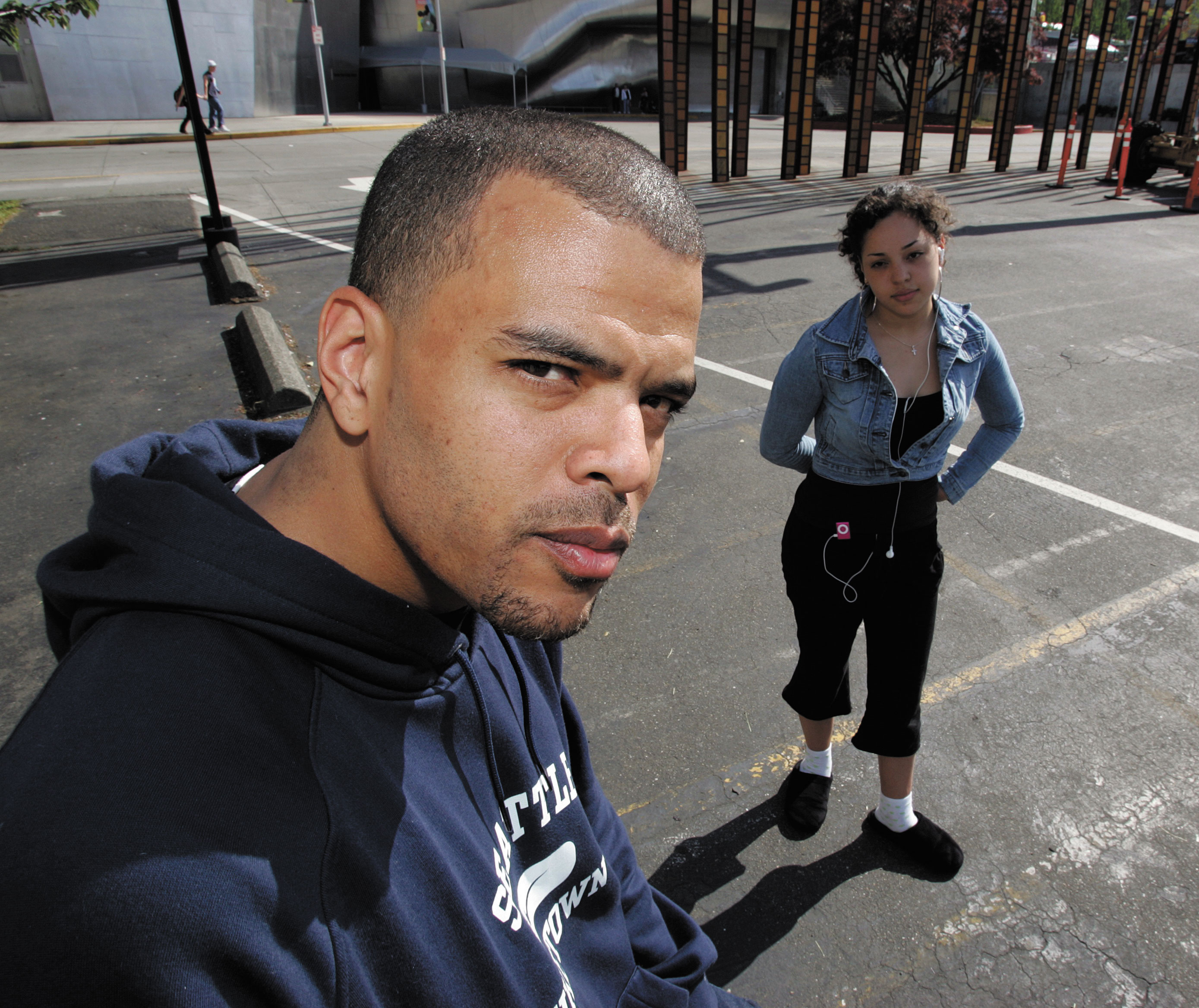 Campbell with his daughter, whose encounter with the cops outside Memorial Stadium led to the DJ's arrest.