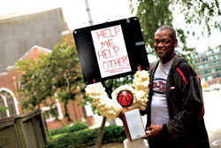 Joe Pace in the U District with one of his talking robots.
